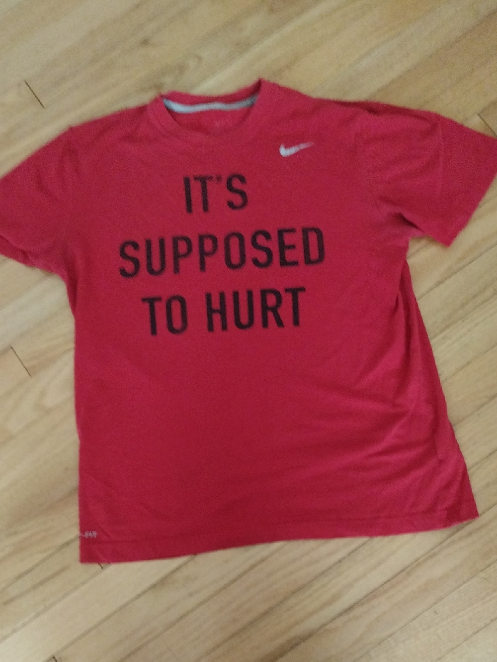 Nike Red Short Sleeve Performance Tee with Black Slogan